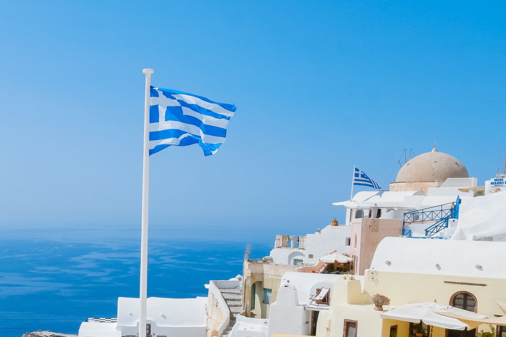 greek flag in oia, santorini