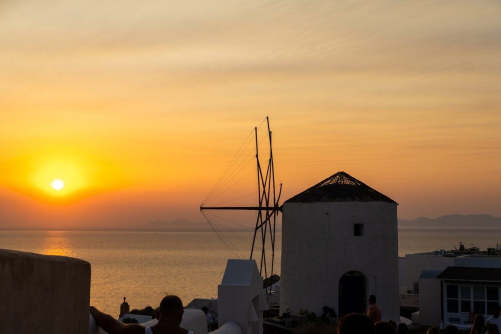 romantic sunset over Oia Santorini