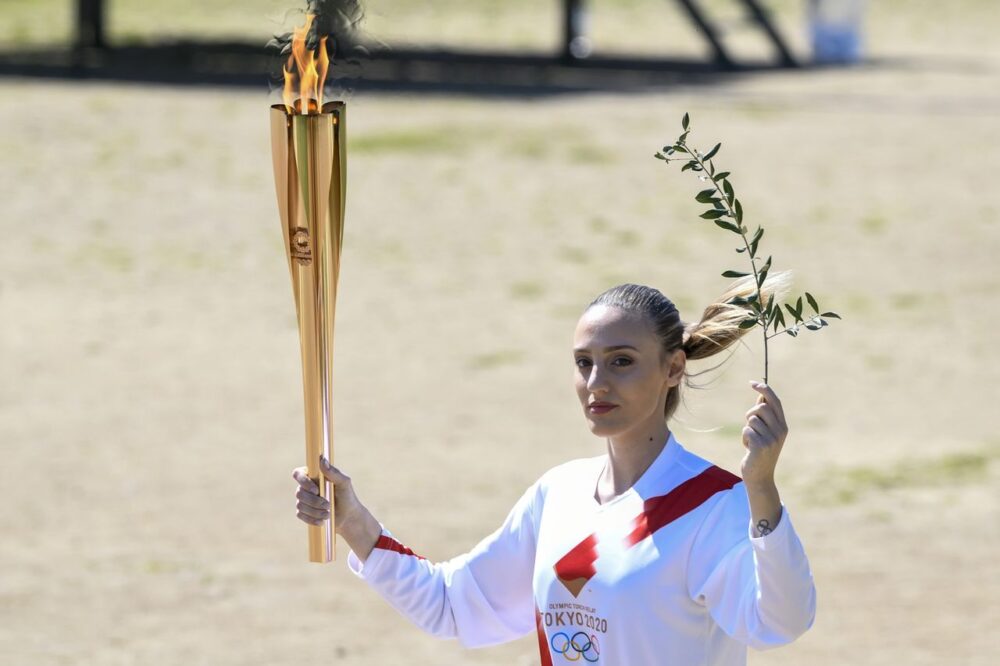 carrying the torch in ancient olympia