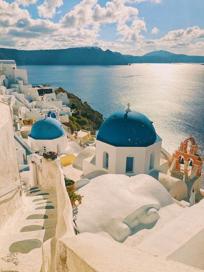 white and blue concrete buildings in santorini